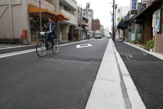 Japanese &#8220;The Way of the Bump&#8221; Road Repair ugly, careless patch in the middle of a newly-paved road -- Kyoto, Japan -- Copyright 2008 Jeffrey Eric Francis Friedl, http://regex.info/blog/