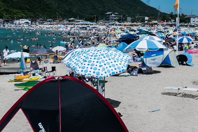 Looks Unfun Wakasawada Beach (若狭和田海水浴場) 1:38 pm (from start: 9h 13m / 107 km / 66.7 miles) taken while cycling at 14 kph (9 mph) -- Wakasawada Beach (若狭和田海水浴場) -- Takahama, Fukui, Japan -- Copyright 2015 Jeffrey Friedl, http://regex.info/blog/
