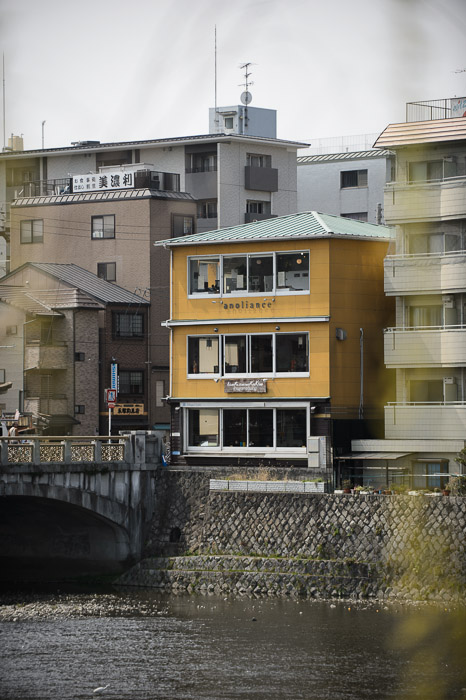 Yellow Building -- Kamo River (鴨川) -- Kyoto, Japan -- Copyright 2013 Jeffrey Friedl, http://regex.info/blog/ -- This photo is licensed to the public under the Creative Commons Attribution-NonCommercial 3.0 Unported License http://creativecommons.org/licenses/by-nc/3.0/ (non-commercial use is freely allowed if proper attribution is given, including a link back to this page on http://regex.info/ when used online)