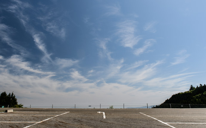 desktop background image of a parking lot at the top of Mt. Hiei (比叡山), Kyoto Japan -- Go Left -- Mt. Hiei (比叡山) -- Copyright 2013 Jeffrey Friedl, http://regex.info/blog/ -- This photo is licensed to the public under the Creative Commons Attribution-NonCommercial 3.0 Unported License http://creativecommons.org/licenses/by-nc/3.0/ (non-commercial use is freely allowed if proper attribution is given, including a link back to this page on http://regex.info/ when used online)