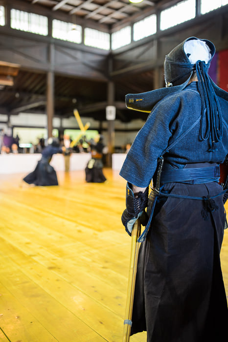 Waiting Kendo master next in line for his match -- 旧武徳殿 -- Kyoto, Japan -- Copyright 2014 Jeffrey Friedl, http://regex.info/blog/ -- This photo is licensed to the public under the Creative Commons Attribution-NonCommercial 4.0 International License http://creativecommons.org/licenses/by-nc/4.0/ (non-commercial use is freely allowed if proper attribution is given, including a link back to this page on http://regex.info/ when used online)