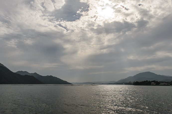 View from the Ferry on the 10-minute ride between the mainland and Miyajima a less-dramatic view than I posted seven years ago -- Miyajima, Hiroshima, Japan -- Copyright 2014 Jeffrey Friedl, http://regex.info/blog/ -- This photo is licensed to the public under the Creative Commons Attribution-NonCommercial 4.0 International License http://creativecommons.org/licenses/by-nc/4.0/ (non-commercial use is freely allowed if proper attribution is given, including a link back to this page on http://regex.info/ when used online)