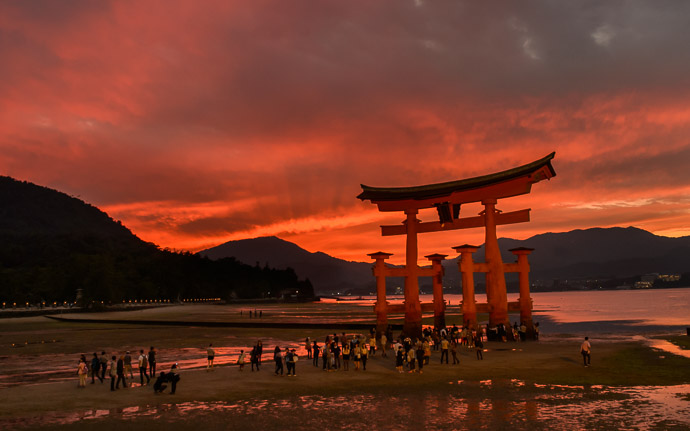 desktop background image of the main gate of the Itsukushima Shrine (厳島神社) at low tide, during sunset the day before a typhoon arrives -- Shrine Gate at Low Tide Itsukushima Shrine (厳島神社) -- Itsukushima Shrine (厳島神社) -- Miyajima, Hiroshima, Japan -- Copyright 2014 Jeffrey Friedl, http://regex.info/blog/ -- This photo is licensed to the public under the Creative Commons Attribution-NonCommercial 4.0 International License http://creativecommons.org/licenses/by-nc/4.0/ (non-commercial use is freely allowed if proper attribution is given, including a link back to this page on http://regex.info/ when used online)