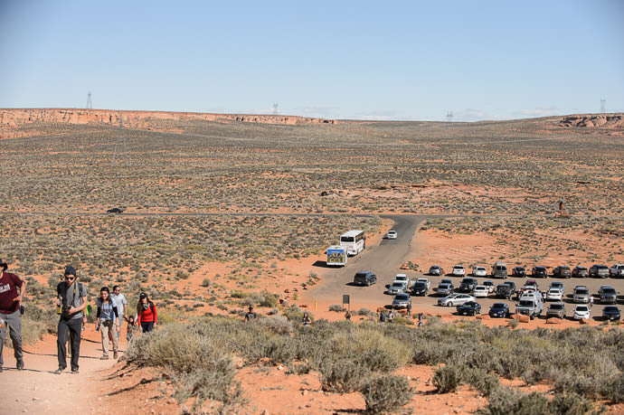 Looking Back at the Parking Lot a dusty splotch of asphalt in the middle of nothing -- Horseshoe Bend -- Page, Arizona, United States -- Copyright 2015 Jeffrey Friedl, http://regex.info/blog/2015-09-09/2615 -- This photo is licensed to the public under the Creative Commons Attribution-NonCommercial 4.0 International License http://creativecommons.org/licenses/by-nc/4.0/ (non-commercial use is freely allowed if proper attribution is given, including a link back to this page on http://regex.info/ when used online)