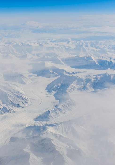 Mile-Wide Glacier from 32,000 Feet at 560 mph, from JL9 (Chicago → Tokyo Narita), above near Palmer Alaska アラスカ州の氷河、日本航空９便（チカゴから成田へ）の窓から -- Palmer, Alaska, United States -- Copyright 2015 Jeffrey Friedl, http://regex.info/blog/ -- This photo is licensed to the public under the Creative Commons Attribution-NonCommercial 4.0 International License http://creativecommons.org/licenses/by-nc/4.0/ (non-commercial use is freely allowed if proper attribution is given, including a link back to this page on http://regex.info/ when used online)