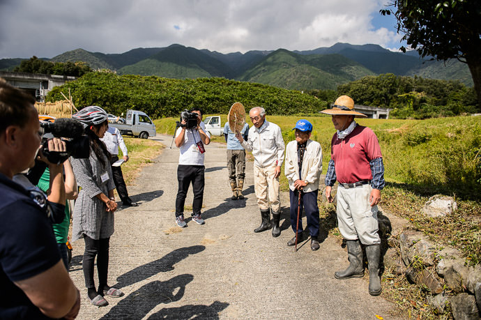 Introductions the 86-year-old man in the blue hat is the chief elder of the local farming community who told us stories about farming in the area when he was a child in the 1930s -- Otsu, Shiga, Japan -- Copyright 2015 Jeffrey Friedl, http://regex.info/blog/