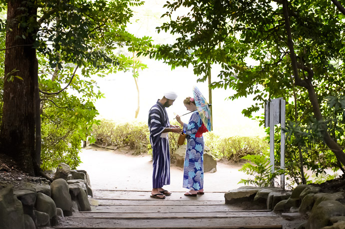 Putting Away the Sun Glasses for a darker area of the gardens -- Heian Shrine (平安神宮) -- Kyoto, Japan -- Copyright 2017 Jeffrey Friedl, http://regex.info/blog/