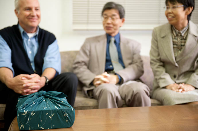 Bible Wrapped in a Furoshiki while Arthur and Doshisha officials look on -- Kyoto, Japan -- Copyright 2008 Jeffrey Friedl, http://regex.info/blog/