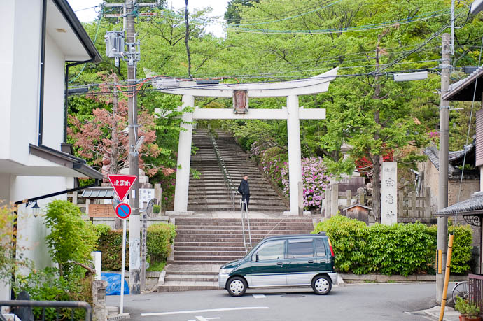 Quintessential Japan Shrine Entrance, Power Lines, Stop Sign, and a Mini Car -- Kyoto, Japan -- Copyright 2009 Jeffrey Friedl, http://regex.info/blog/
