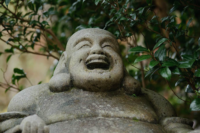 &#8220; I Laugh at your Decomposable Body&#8221; ( I suspect that is not the thought the carver had in mind ) -- Nishimura Stone Lanterns workshop and garden -- Kyoto, Japan -- Copyright 2009 Jeffrey Friedl, http://regex.info/blog/
