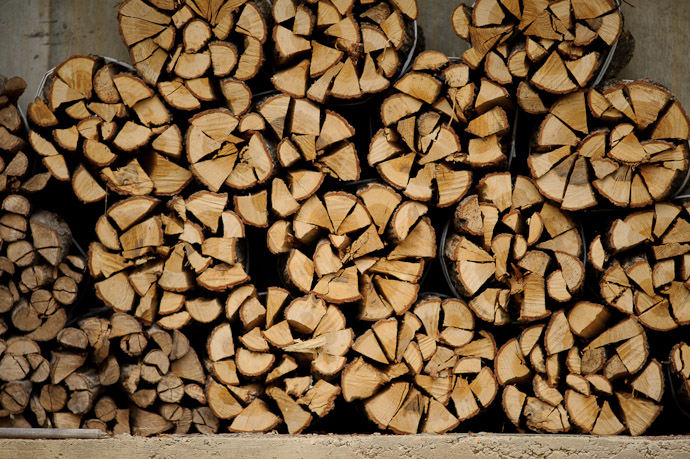 desktop background image of stacked firewood in Japan -- Prepared for Winter -- Uji, Kyoto, Japan -- Copyright 2011 Jeffrey Friedl, http://regex.info/blog/