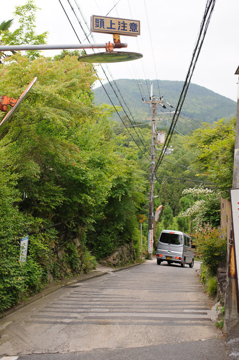 Car Heading Down note the mirror facing down -- Kyoto, Japan -- Copyright 2015 Jeffrey Friedl, http://regex.info/blog/